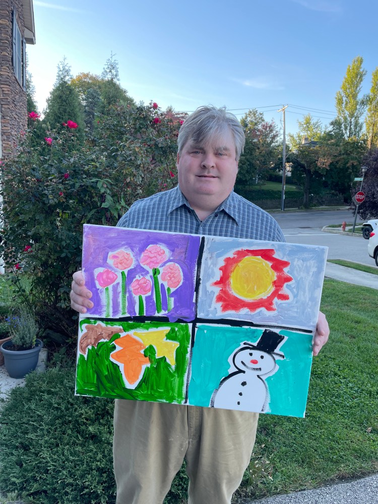 Ted and one of the paintings he donated for Merakey's 18th annual gala and silent auction.